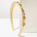 Detail of yellow padded headband featuring crystal butterflies and square rhinestones - Yellow
