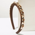 Macro detail of coffee silk headband with amber crystal butterflies and square gems - Brown
