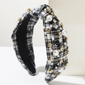 Detail of Christmas headband with checkered fabric, faux pearls, and snowflake patterns - Black and White