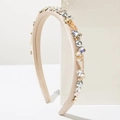Close-up of baroque headband featuring crystals, champagne diamonds, and grey pearls - Beige