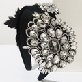 Macro view of crystal flower detail on luxurious black velvet baroque headband - White