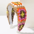 Detailed macro view of handmade crochet floral headband with colorful knitting patterns - Coffee Multicolor
