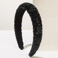 Close-up of wide-brimmed black headband featuring dense shimmering sequins and velvet lining - Black