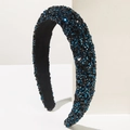 Close-up of padded headband with navy sequins on a minimalist geometric white stand - Black and Blue
