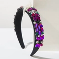 Detail of baroque headband featuring colorful crystals and white pearl bow embellishment - Red