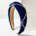Close-up of luxury navy blue velvet headband with sparkling crystals and rhinestones - Blue