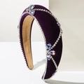 Detailed macro view of purple velvet headband with silver diamond chains and teardrop gems - Purple