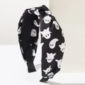 Detail of Halloween knot headband featuring white cartoon ghost prints on black fabric - Ghost