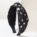 Detail of Halloween knot headband with white stars and crescent moon patterns on black fabric - Moon & Star