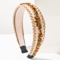 Close-up of woven headband featuring amber rhinestones and dark brown stitching detail - Brown
