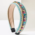 Detail of bohemian woven headband featuring colorful rhinestones and mixed yarn texture - Blue