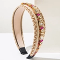 Detailed view of bohemian braided headband with colorful rhinestones and gold metal settings - Brown