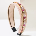 Detail of bohemian knit headband with pink rhinestones and braided texture - Pink