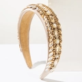 Detailed macro view of luxury baroque headband with crystals and pearls on champagne satin - Brown