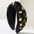 Detail eines schwarzen Stoffhaarreifens mit Bienen, Blumen und Kristallen - Schwarz