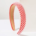 Detailed view of red pearl headband with white faux pearls and soft velvet inner lining - Diagonal Stripes Red