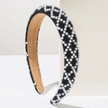 Close-up of black velvet headband with white pearls in geometric diamond patterns - Grid Black