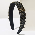 Diadema ancha de estilo barroco con cristales negros y montura dorada en tela satinada - Negro