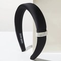 Elegante cerchietto nero imbottito con perle e texture setosa per donne - Nero