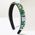 Detailed close-up of Baroque headband with multicolored rhinestones and floral elements - Blue
