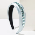 Elegant light blue satin headband featuring sparkling oval crystals and smooth fabric - Blue