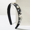 Detail of baroque velvet headband featuring sparkling crystals and woven pearl tassels - Black