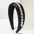 Elegant black satin headband featuring a row of sparkling oval rhinestones for women - Black