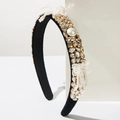Detail of baroque headband featuring champagne crystals and white pearls on black velvet - Brown