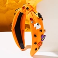 Detail of orange Halloween knotted headband with 3D ghost, pumpkin and crystal accents - Orange