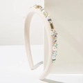 Elegant beige fabric headband featuring white pearls, rhinestones, and metal accents - White