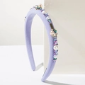 Elegant purple knitted headband featuring colorful rhinestones and pearl flower accents - Purple