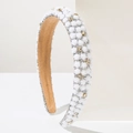 Detail of white 3D flowers and silver rhinestones on a vintage baroque headband - White
