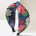 Close-up of bohemian floral knot headband with deep blue fabric and vibrant print - Blue Gradient