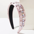 Detail of pink satin headband with white pearls and colorful crystals in retro style - Pink