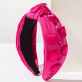 Macro detail of fuchsia knotted headband with 3D fabric hearts and pink rhinestones - Rose Gold