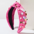 Detail view of pink knot headband with colorful rhinestones, pearls and heart wings - Rose Red