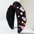 Cerchietto annodato nero con perle, strass e accessori a forma di cuore con ali - Nero