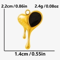 Detail of gold heart pendant with black drip design and DREAM engraving - Gold Black (S2099-G-B)
