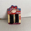 Detail of durable black elastic hair ties for girls on a cute cartoon display card - Style A (Cartoon Girl Card)