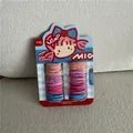 Macro detail of colorful kids hair elastics set on a decorative cardboard display card - Style C (Cartoon Girl Card)