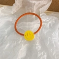 Cute orange elastic hair tie with a bright yellow acrylic smiley face charm for girls - Yellow Smiley Face