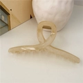 Detail of a cream translucent jelly hair claw clip on a minimal white aesthetic background - Yellow (Jelly)