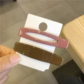 Minimalist geometric hair clips in olive green and dusty pink on a white card - Coffee + Purple