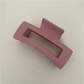 Close-up of matte dusty pink rectangular hair claw clip with a hollow geometric design - Matte Pink (C3.5)