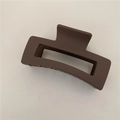 Top view of a matte coffee brown rectangular hollow hair claw clip on a beige background - Matte Coffee (C3.5)