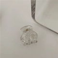 Dettaglio della molletta per capelli trasparente con molla in metallo e pois - C3.5 Trasparente (piccola Spina A Tre Poli)