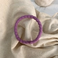 Elastic purple hair tie with ribbed texture for daily wear on beige canvas background - Purple