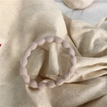 Elastic seamless wavy ribbed hair tie in dusty pink for women's daily hair styling - Off White