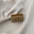 Retro wood grain hair claw clip with brown texture on a beige silk fabric background - C1.4 Bone Shape Claw