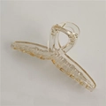 Eleganter bernsteinfarbener transparenter Haarklammer mit gekreuztem Design - Champagner